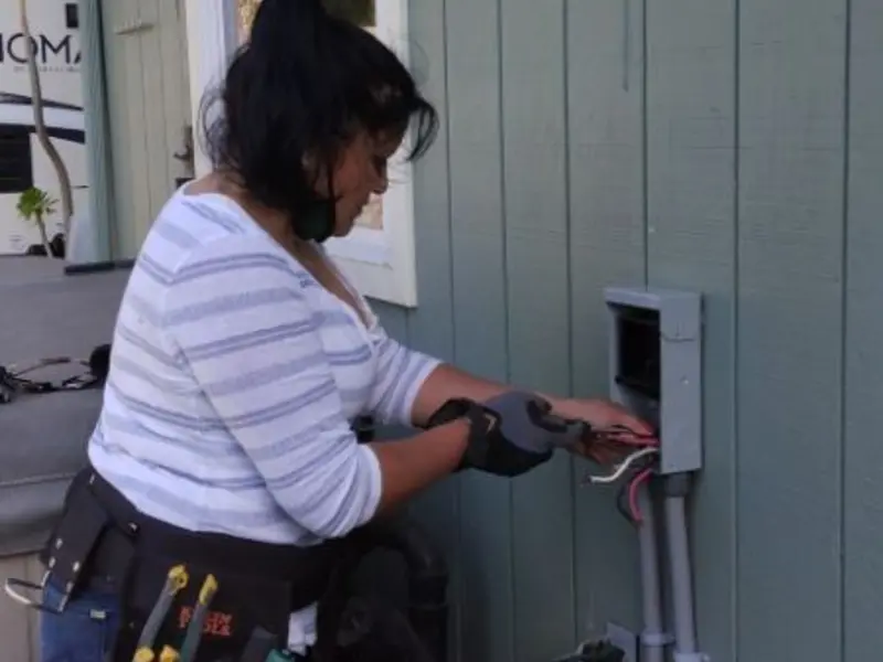 Licensed electrician wiring an exterior subpanel in Lititz